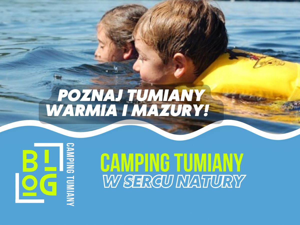 Dzieci w kamizelkach ratunkowych pływają w jeziorze, promując zielona szkoła edukacja w sercu Warmii i Mazur.